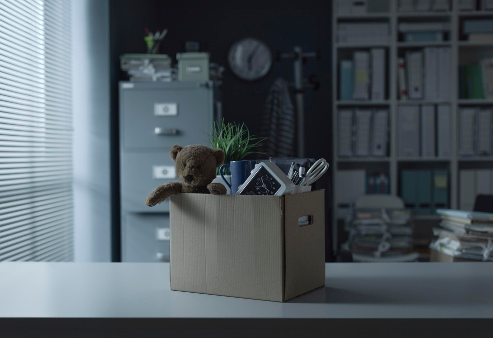 cardboard-box-filled-with-employee-s-personal-belongings-job-dismissal-relocation-concept