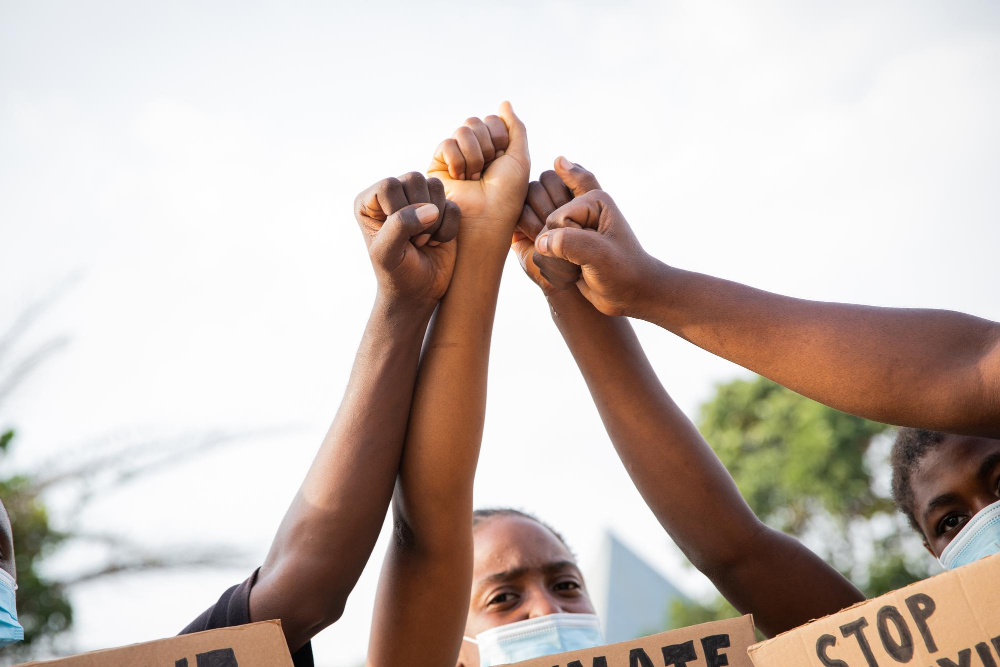 closeup-raised-fists-group-african-guys-protesting